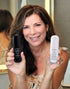  50's model holding Age Less Super Serum Kit 
